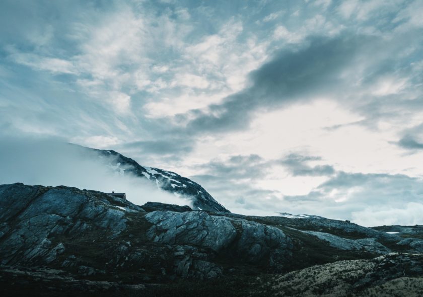 A view of a mountain on a mountain on a cloudy day